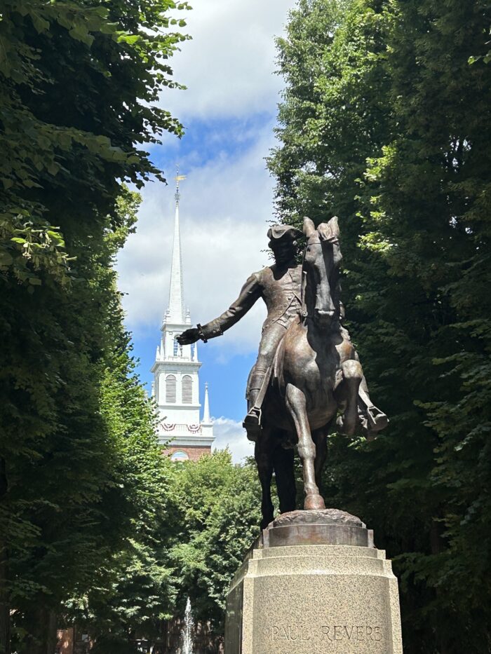 Photo of Paul Revere's statue in front of the Old North Church tower